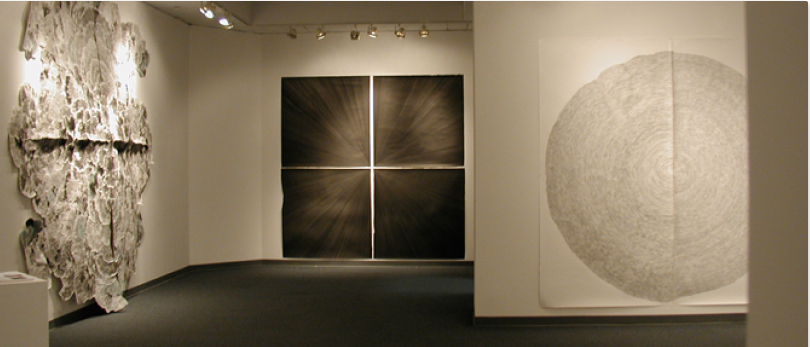 Interior of the Visual Arts Gallery featuring large abstract artwork on the walls